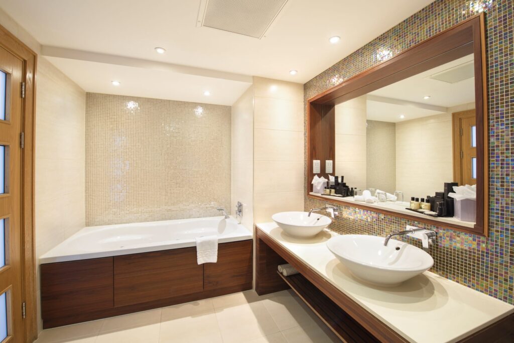Bathroom with two basins and bath
