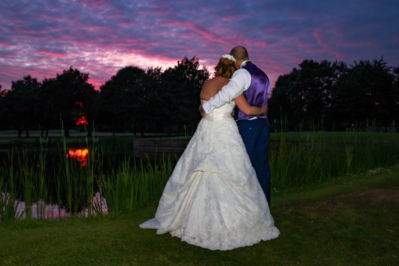 Bride and groom at sunset