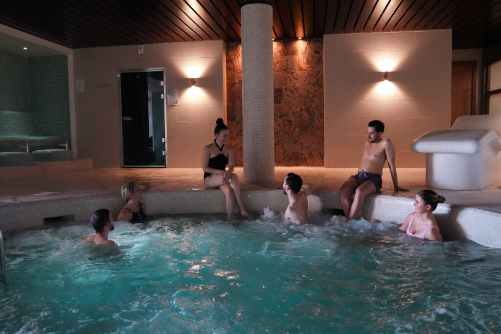 people in a jacuzzi pool