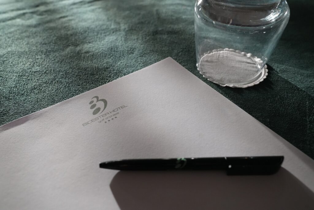 Glass and paper on meeting room table
