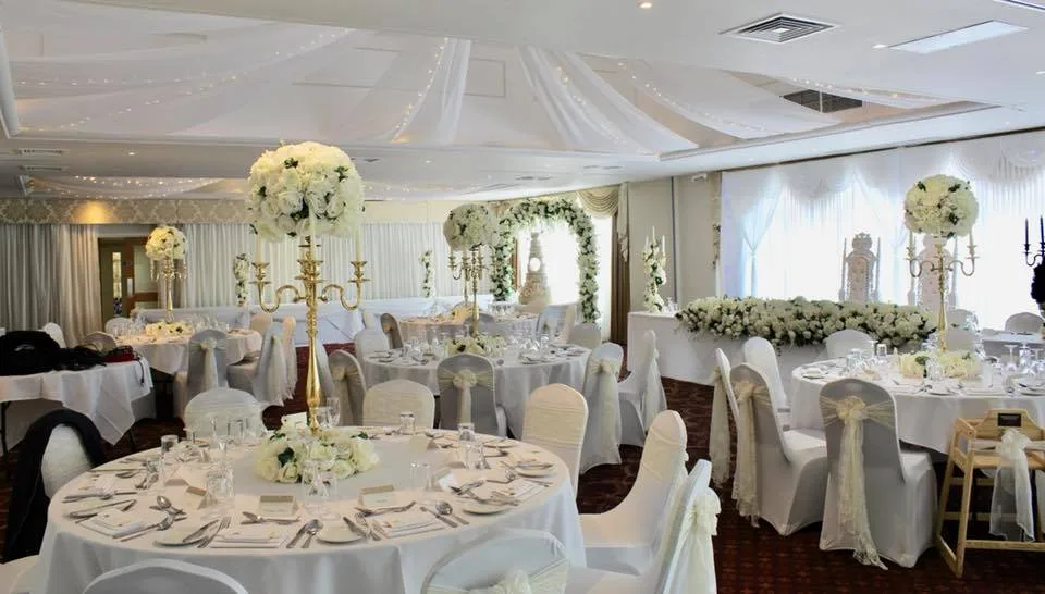 Decorated wedding reception with white flowers